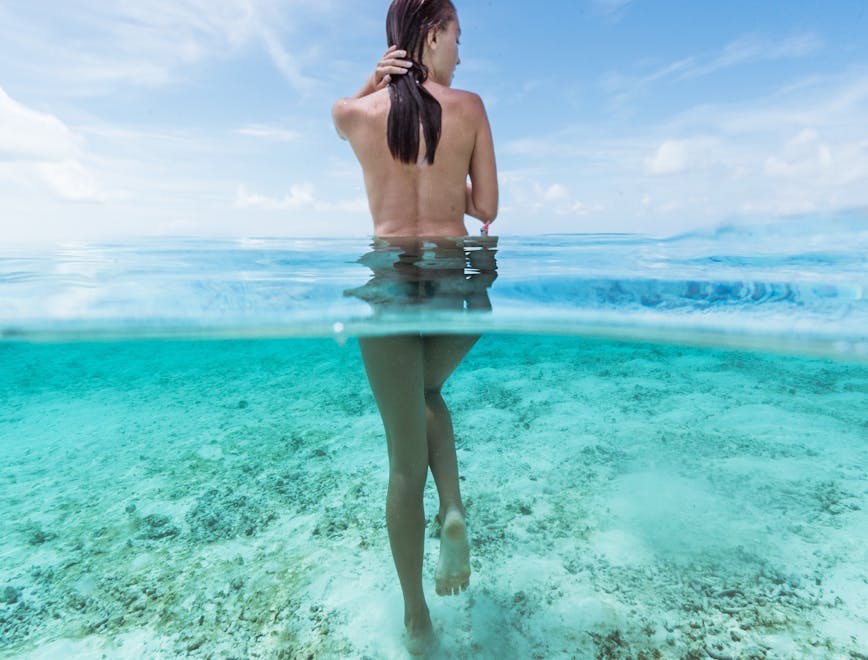 person clothing water nature outdoors vacation shorts back skin sea