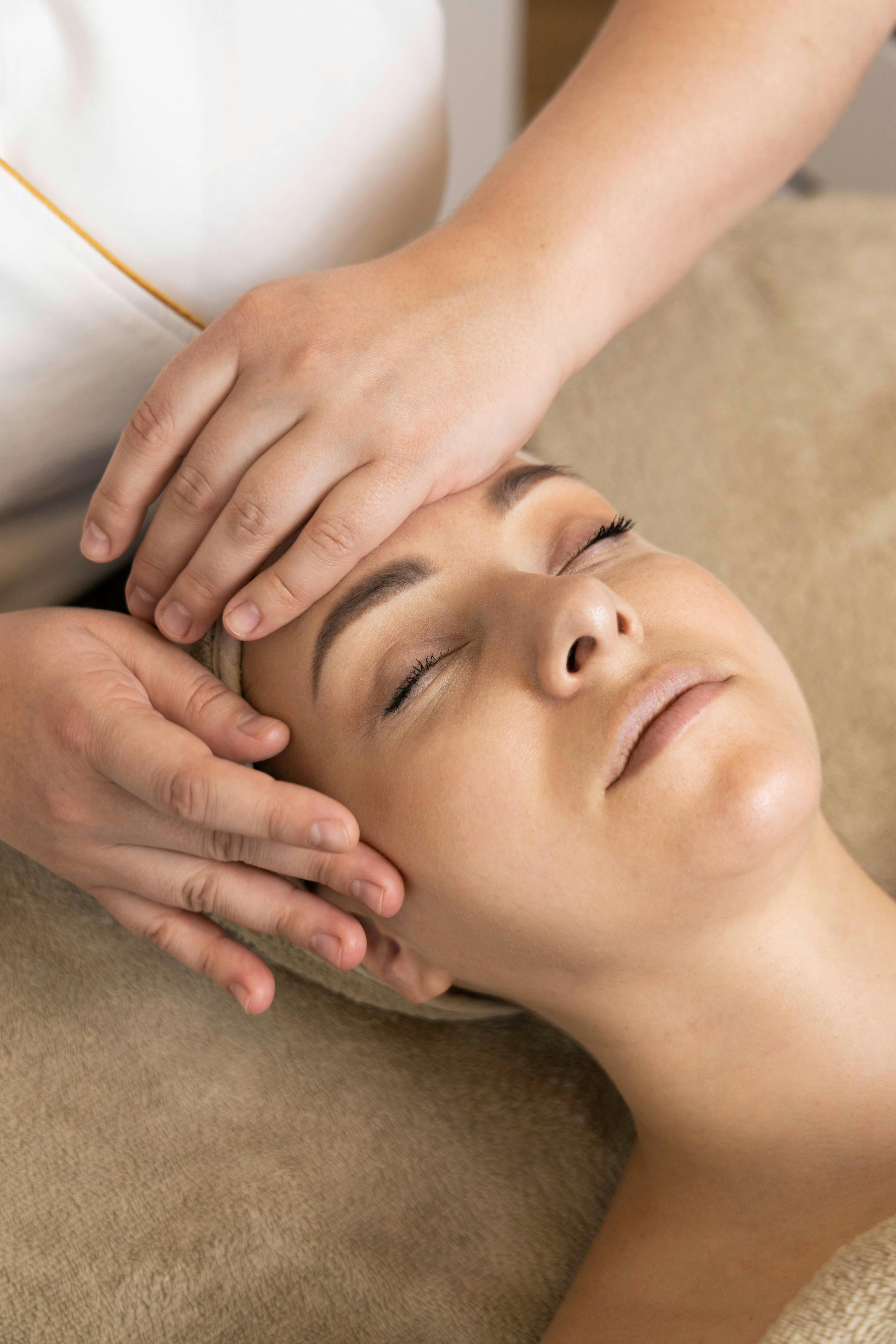 massage person patient head face